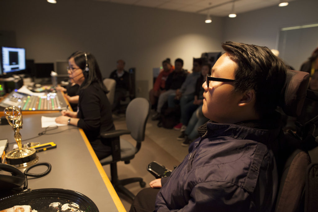 A Luther Burbank High School student watches KVIE staff direct an episode of Studio Sacramento