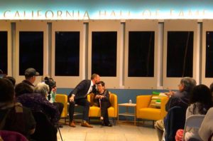 Rob Stewart embraces Reiko Negumo during a presentation