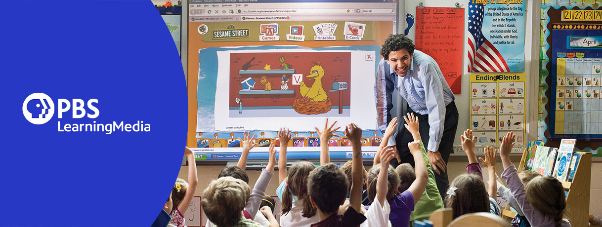 Teacher looking at little students raising hands