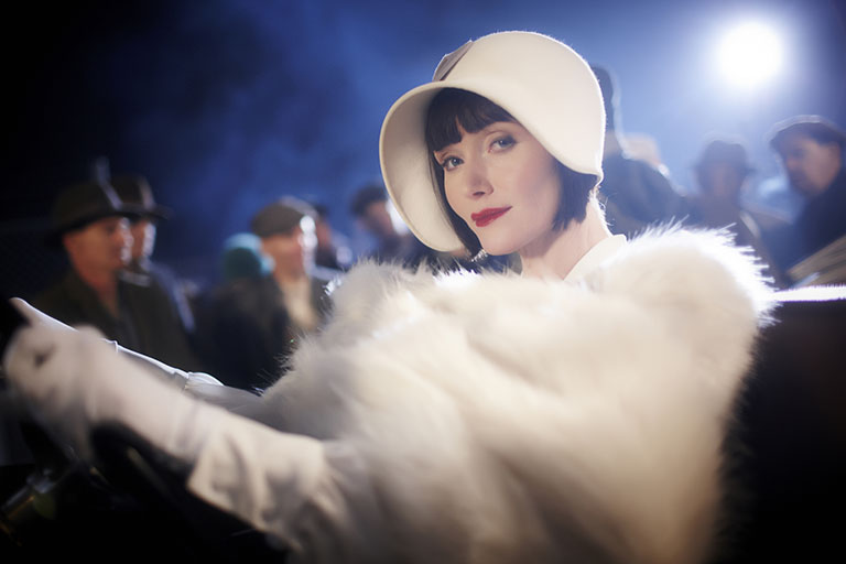 A young man lies in Phryne’s arms. It’s not scene of glorious seduction but murder.
